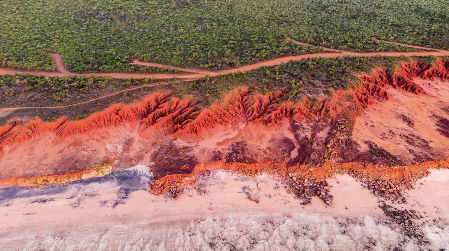 Aerial view of red cliffs and coastline